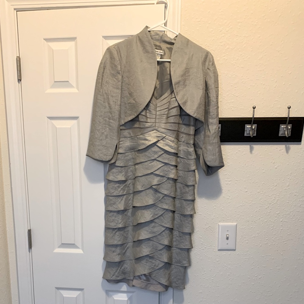 Dressy silver ruffled dress with short jacket. Size 4. May run slightly larger.